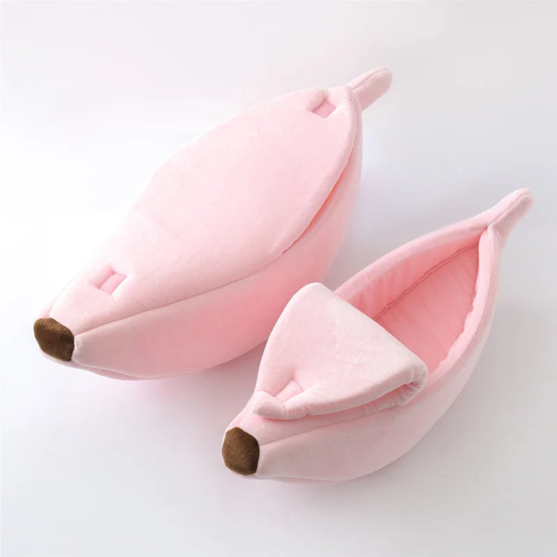 Pink banana-shaped slippers on a white background